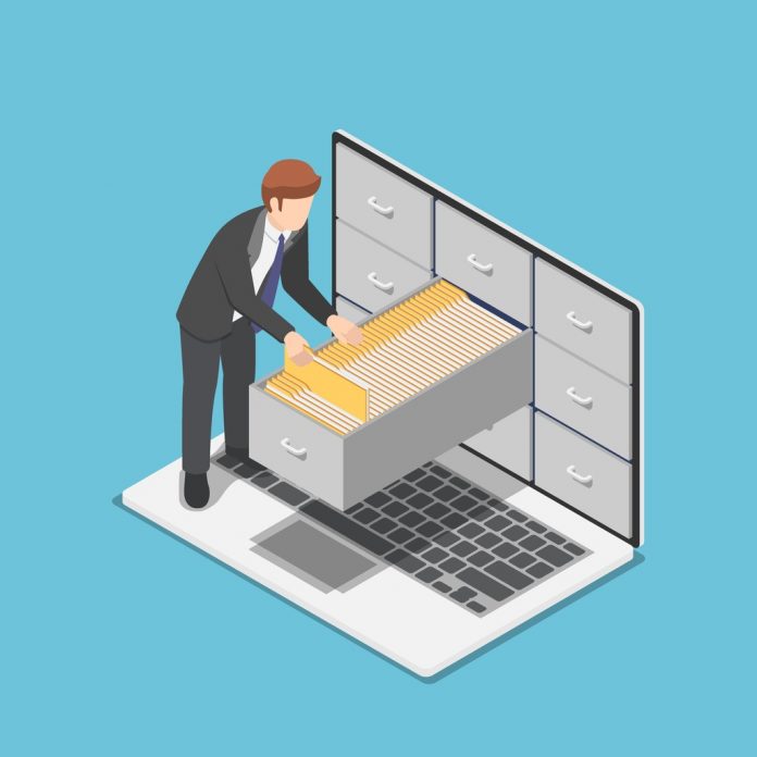 isometric businessman manage document folders in cabinet inside the vector id1128491422